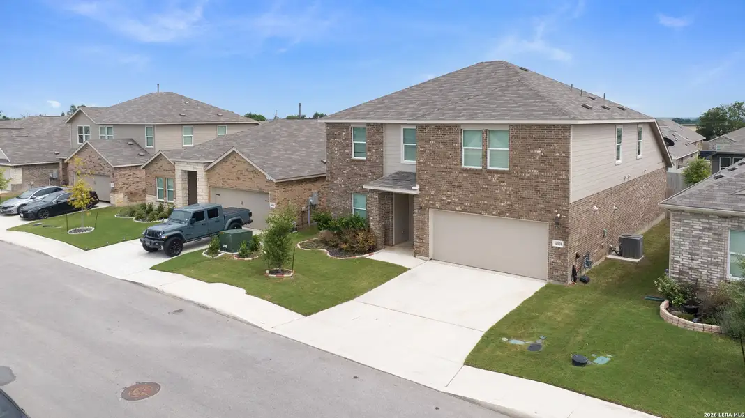 Front exterior of a new home in Brookmill, San Antonio, TX, highlighting curb appeal (Image 22). Front exterior of a new home in Brookmill, San Antonio, TX, highlighting curb appeal (Image 22).