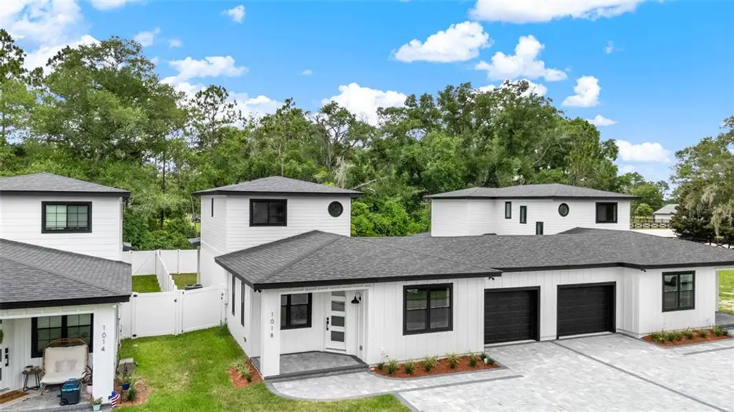 Front exterior of a new home in , Eustis, FL, highlighting curb appeal (Image 2). Front exterior of a new home in , Eustis, FL, highlighting curb appeal (Image 2).