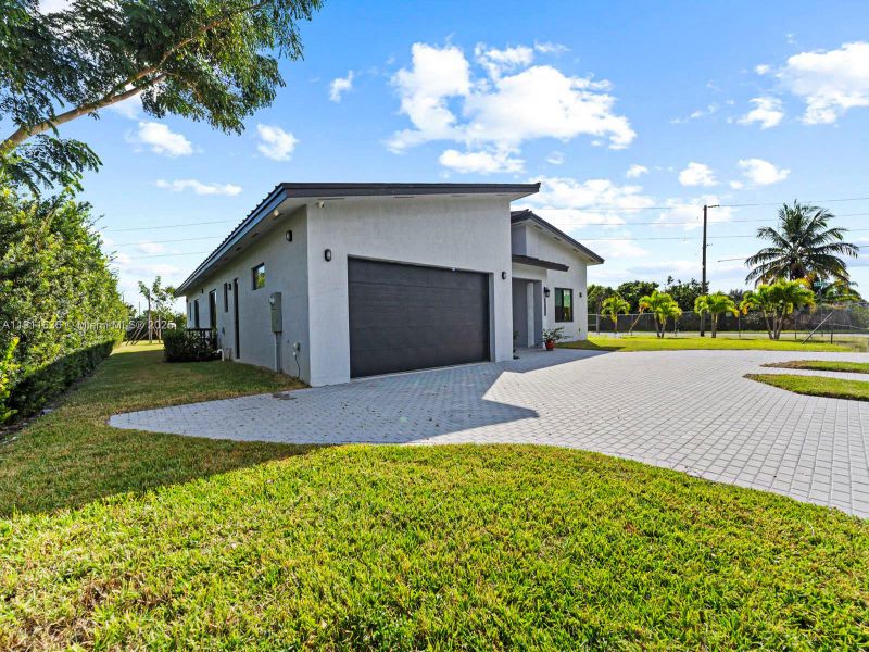 Front exterior of a new home in , Goulds, FL, highlighting curb appeal (Image 1). Front exterior of a new home in , Goulds, FL, highlighting curb appeal (Image 1).