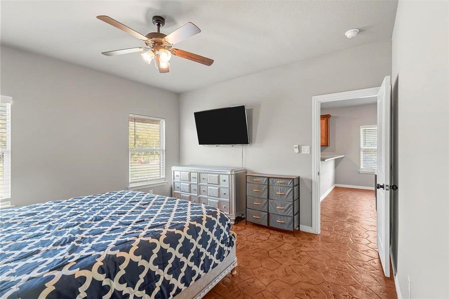 Primary Bedroom featuring ceiling fan