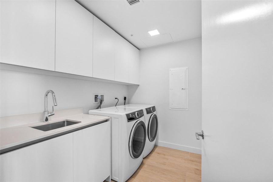 Large Laundry Room w/ Storage closet. Large Laundry Room w/ Storage closet.