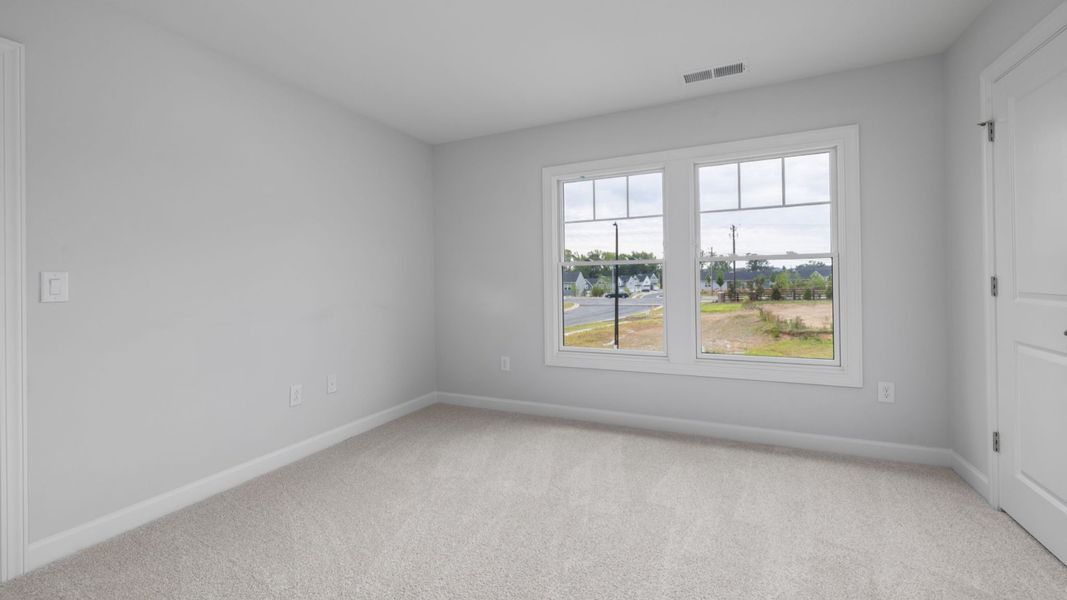 Spacious, unfurnished interior of a new home in The Courtyards at Oak Grove, Durham (Image 24).