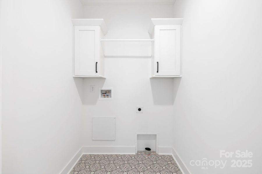 Main Level Laundry w/ door to hall & Primary Suite Main Level Laundry w/ door to hall & Primary Suite