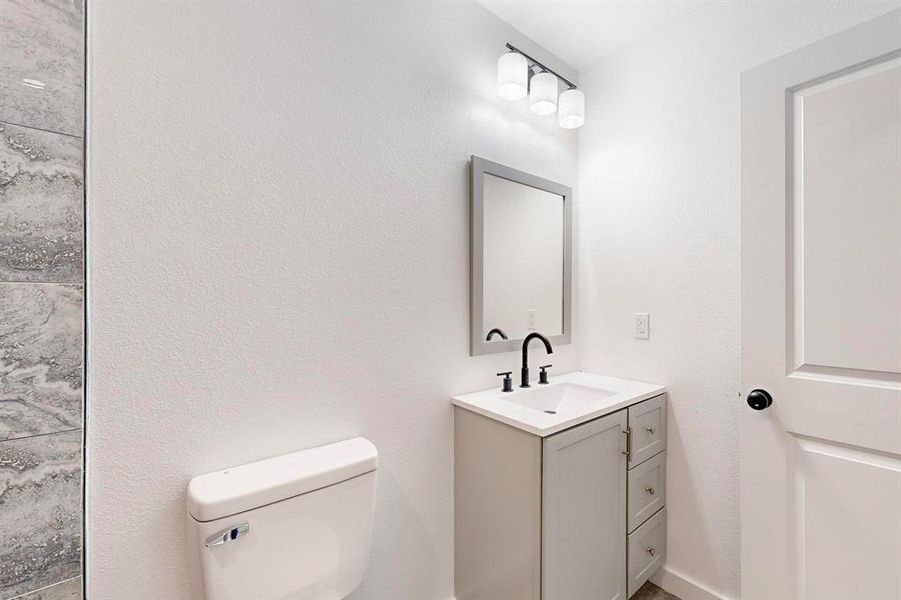 Bathroom with vanity and toilet