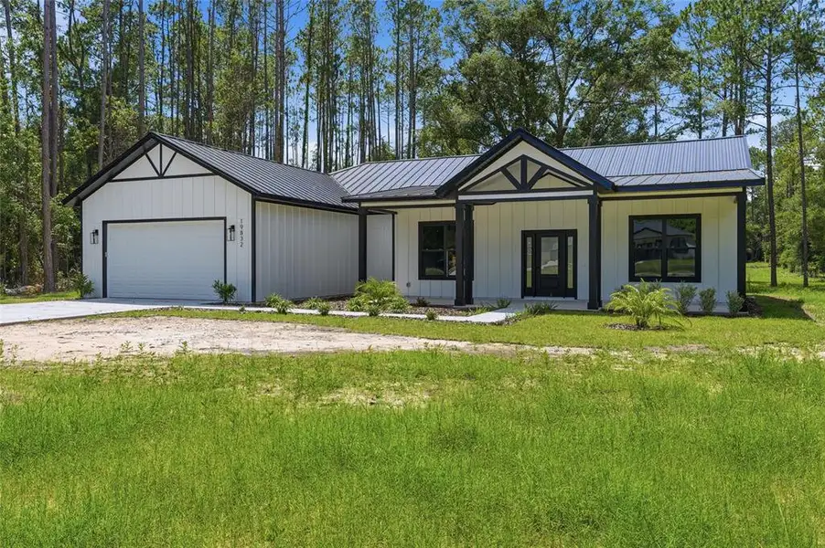 Front exterior of a new home in , High Springs, FL, highlighting curb appeal (Image 1). Front exterior of a new home in , High Springs, FL, highlighting curb appeal (Image 1).