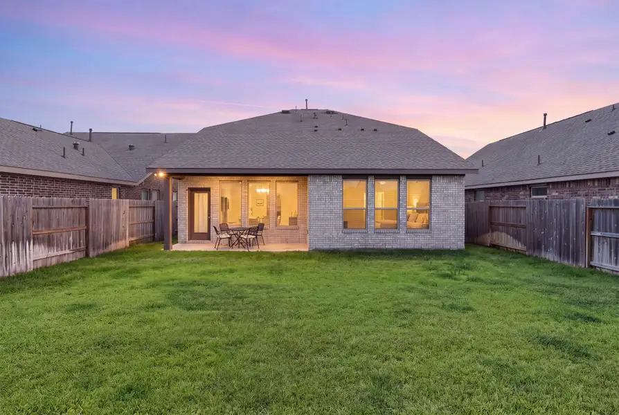 A large covered back patio for enjoying those early morning coffees and those late night dinners with friends.