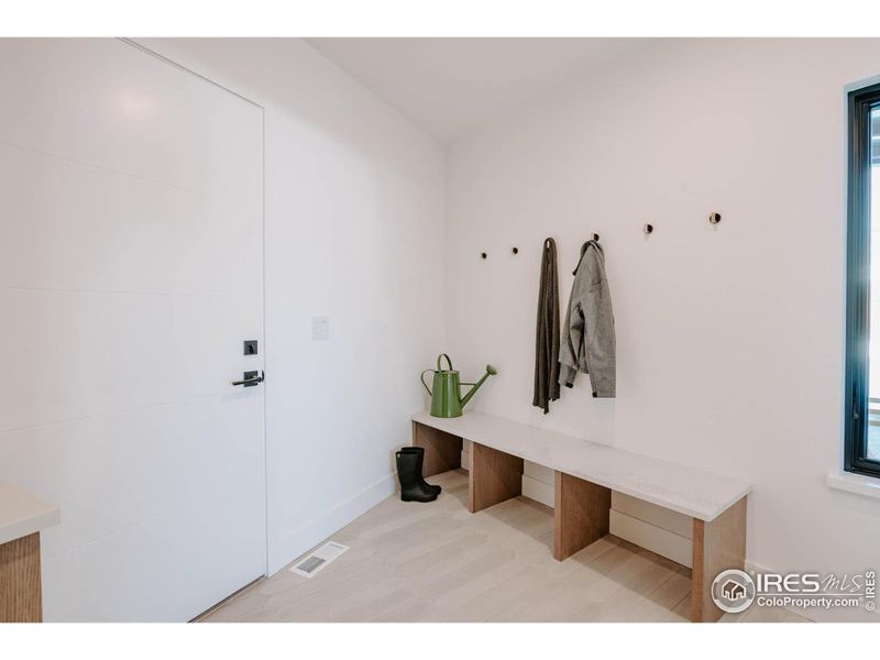 Mudroom adjacent to garage