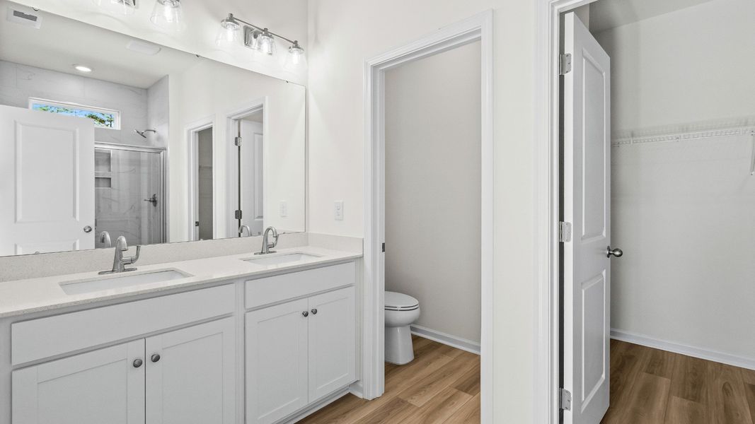 Dual vanities and clean finishes elevate the Easton’s primary bath Dual vanities and clean finishes elevate the Easton’s primary bath