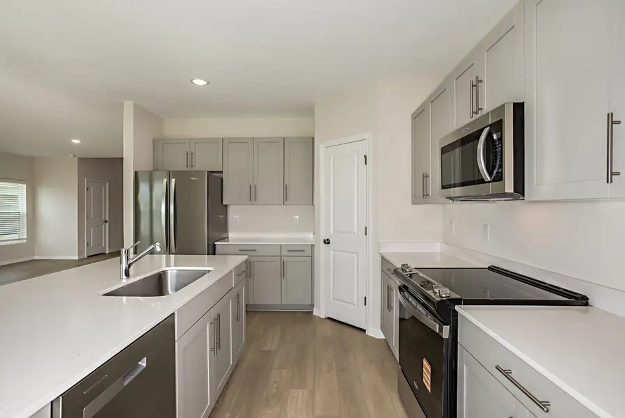 Furnished interior view inside a new home in Scenic Terrace, Haines City (Image 4).