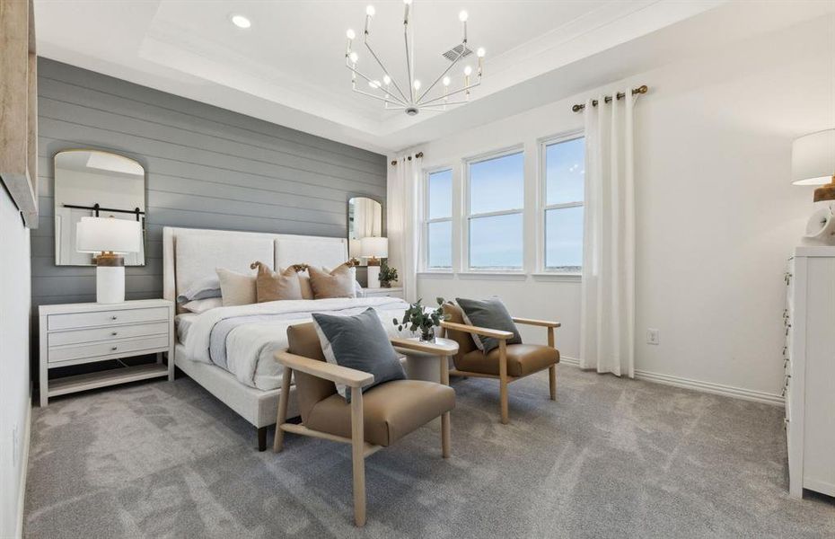 Spacious owner's suite bathed in natural light *Model representation