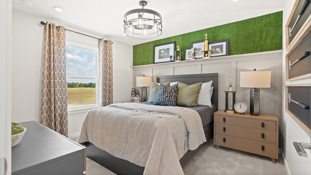 Golf themed bedroom overlooking the course New Construction Home in Winter Haven by DRB Homes in Willowbrook North