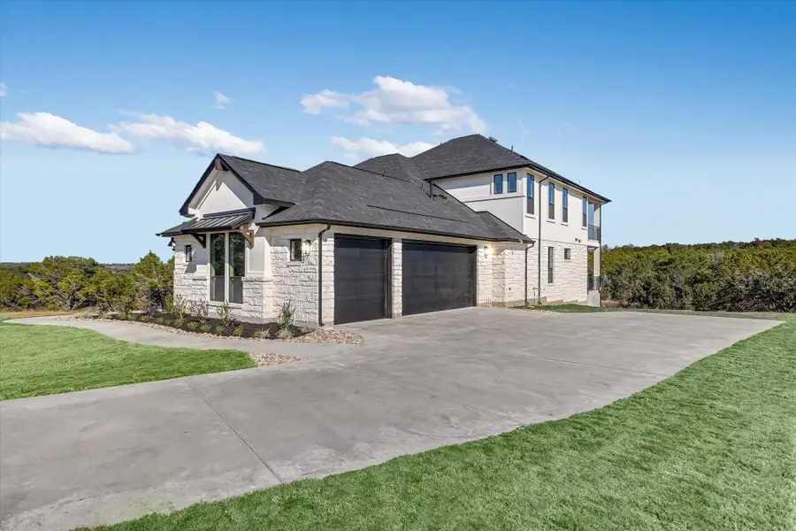 Representative exterior photo of a completed home built from the Santa Barbara II by Giddens Homes in Scofield Farms Estates, Georgetown, TX (Image 30).