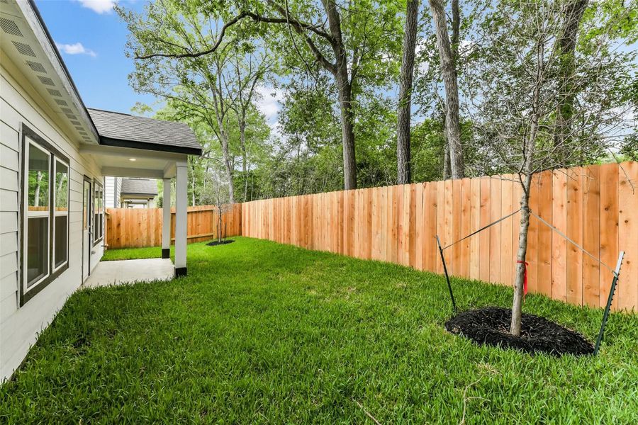 Front exterior of a new home in Caney Creek Place, Conroe, TX, highlighting curb appeal (Image 83).