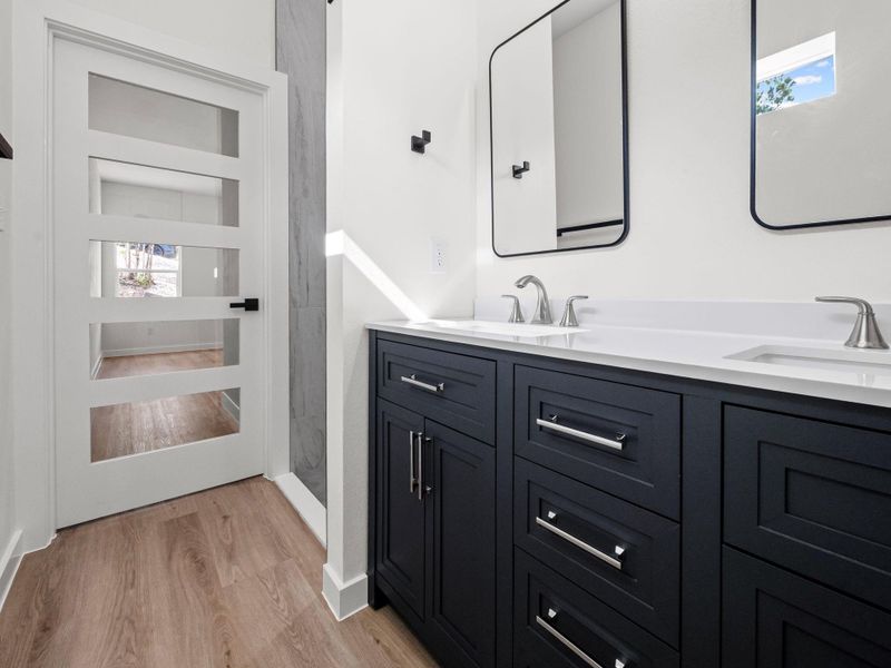 Dual vanity with white countertop and undermount sinks