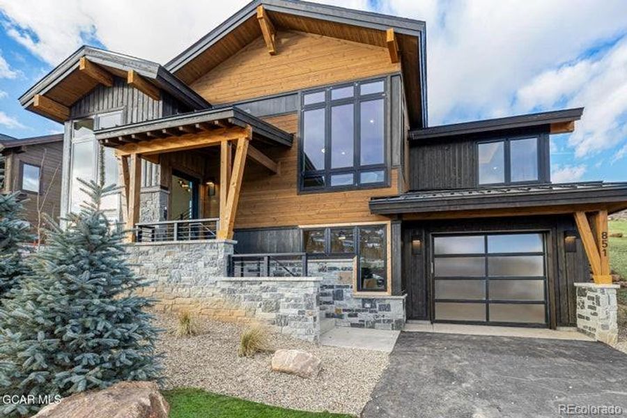 Exterior details and patio area of a home in , Granby (Image 4).