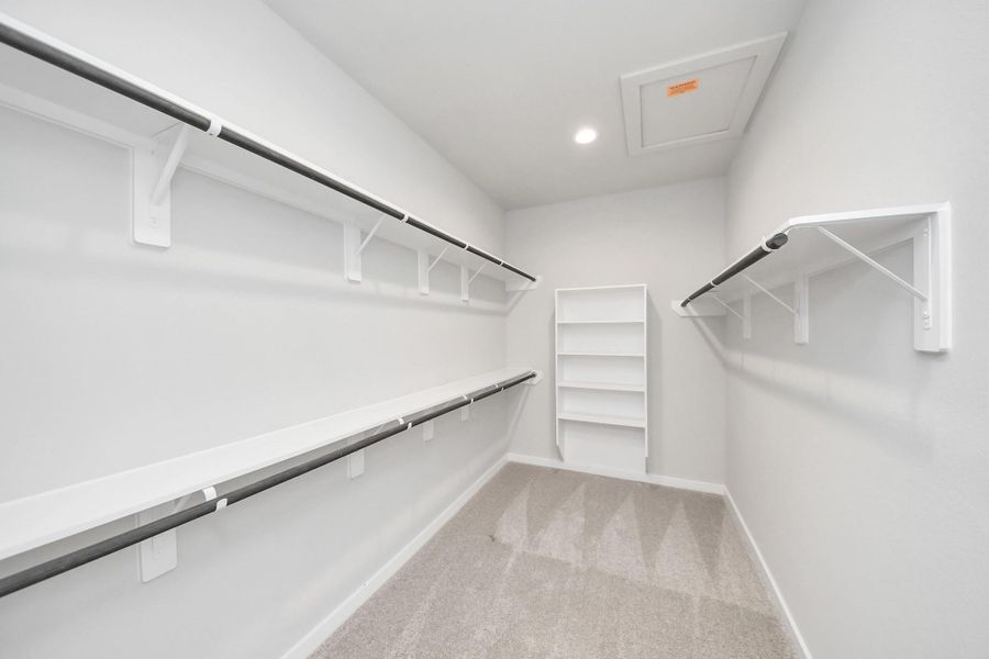 Walk-in closet that epitomizes luxury and practicality. Sample photo of completed home with similar plan. Actual colors and selections may vary. Call for more info.