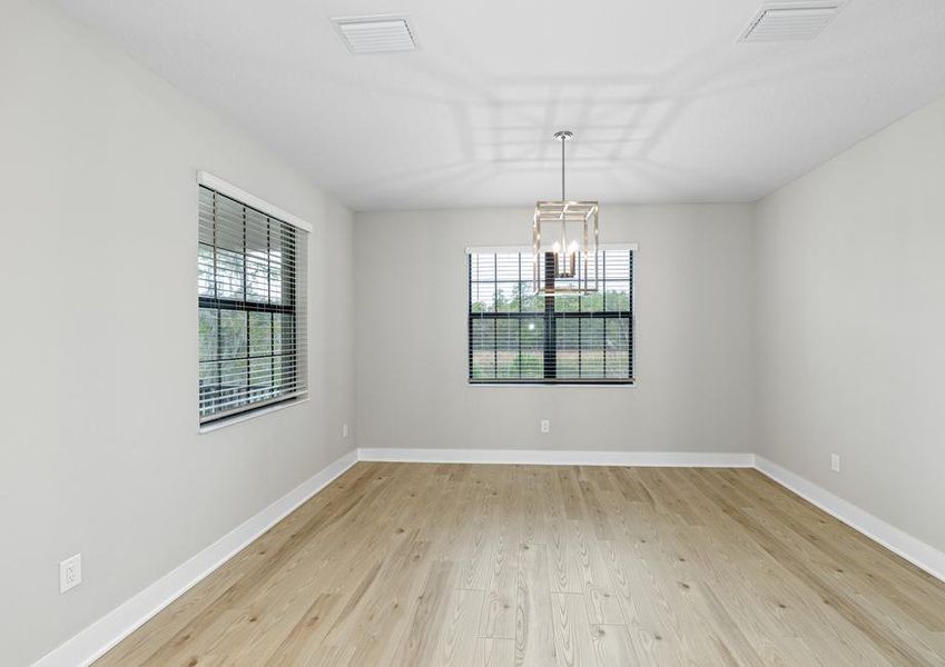 The dining nook is located off the kitchen.