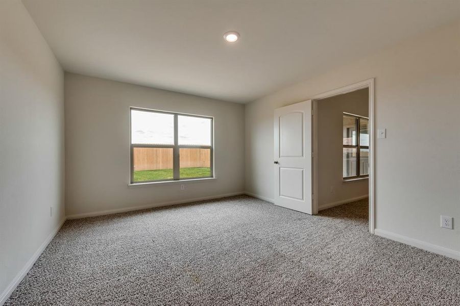 Unfurnished room with carpet