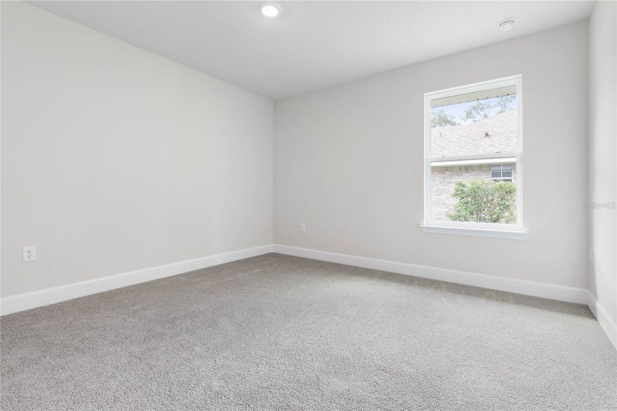 Spacious, unfurnished interior of a new home in Orange Blossom Hills, Summerfield (Image 27).