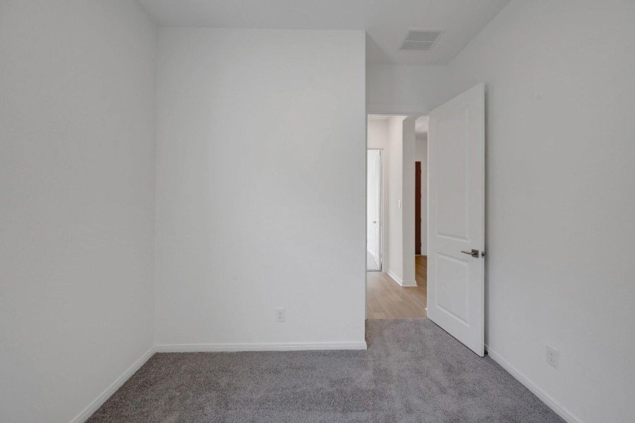 Spacious, unfurnished interior of a new home in Meridiana - Terrace Collection, Manvel (Image 11).
