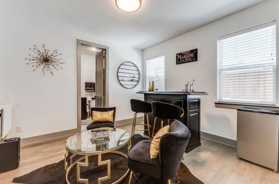 Bedroom with wood finished floors and en suite bathroom