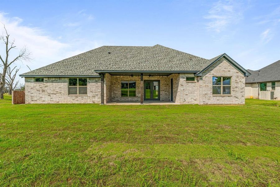 Exterior details and patio area of a home in Pecan Plantation, Granbury (Image 29).