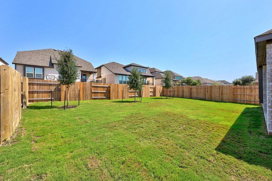 Fenced backyard featuring a residential view Fenced backyard featuring a residential view