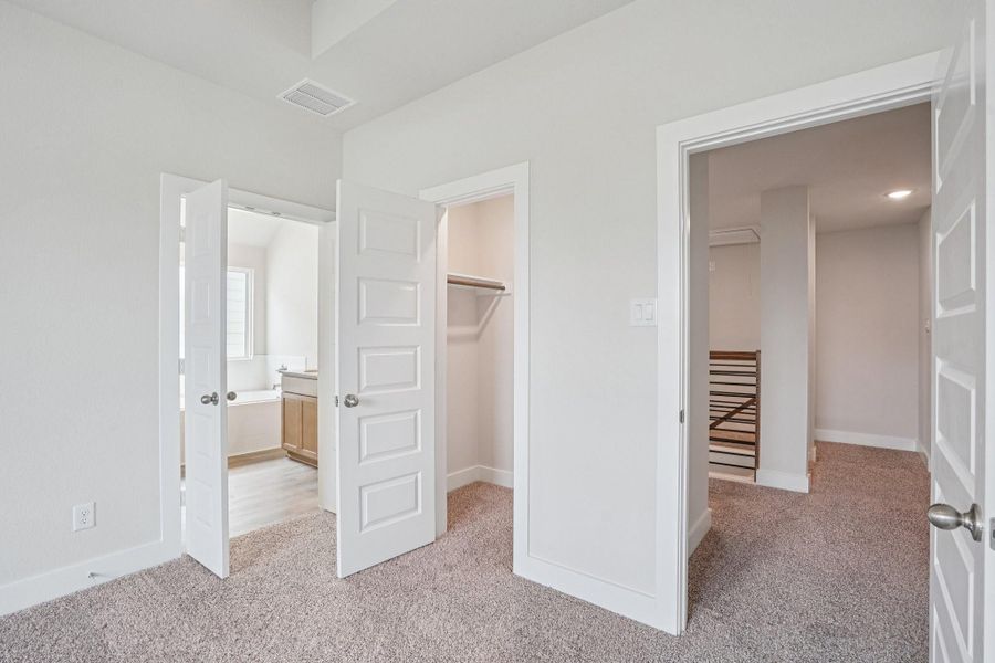 The owner’s suite, complete with a spacious walk-in closet and a luxury bathroom option provides the perfect space to relax.