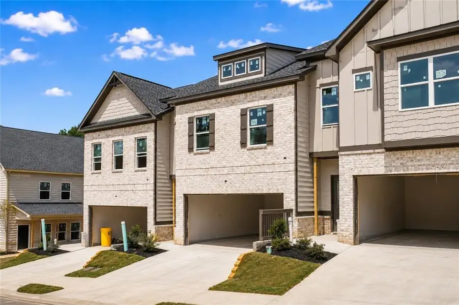 Front exterior of a new home in , Norcross, GA, highlighting curb appeal (Image 1). Front exterior of a new home in , Norcross, GA, highlighting curb appeal (Image 1).