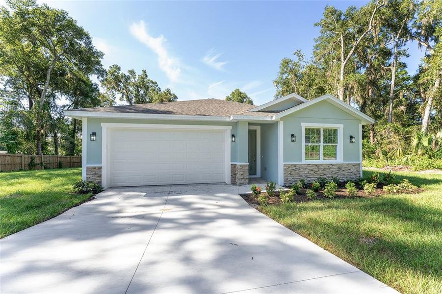 Front exterior of a new home in , Belleview, FL, highlighting curb appeal (Image 22).