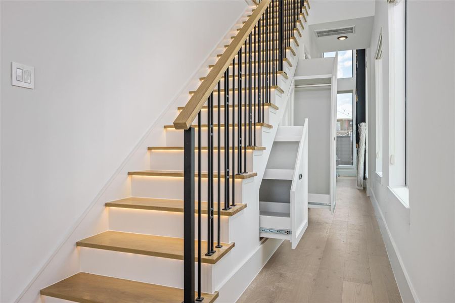 Innovative under-stair storage offers space-saving solutions for shoes, coats, and essentials—every inch of this home is purposefully designed Innovative under-stair storage offers space-saving solutions for shoes, coats, and essentials—every inch of this home is purposefully designed