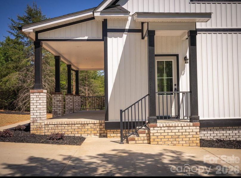 Exterior details and patio area of a home in , Oakboro (Image 27).
