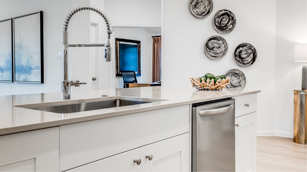 Stainless steel undermount single-bowl sink with a pull-down spray faucet