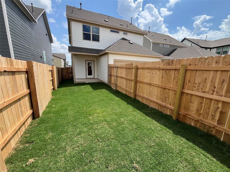 Front exterior of a new home in The Cottages at Lariat, Liberty Hill, TX, highlighting curb appeal (Image 1). Front exterior of a new home in The Cottages at Lariat, Liberty Hill, TX, highlighting curb appeal (Image 1).