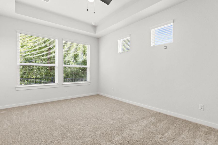 A quiet retreat with plush carpeting and abundant natural light from multiple windows. A quiet retreat with plush carpeting and abundant natural light from multiple windows.