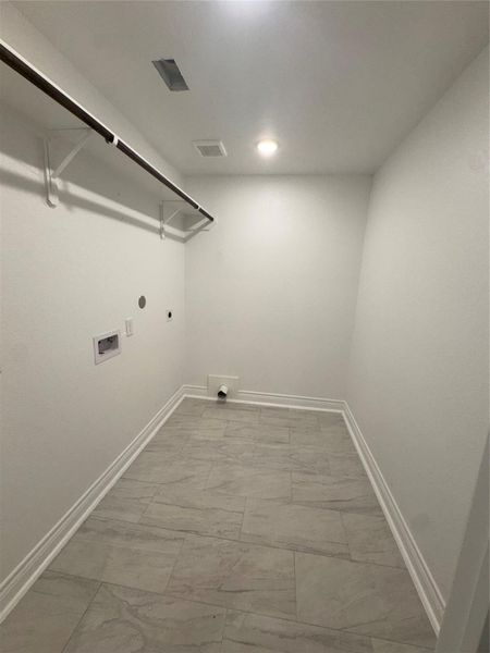 over sized laundry room with room for an extra refrig. or freezer if needed