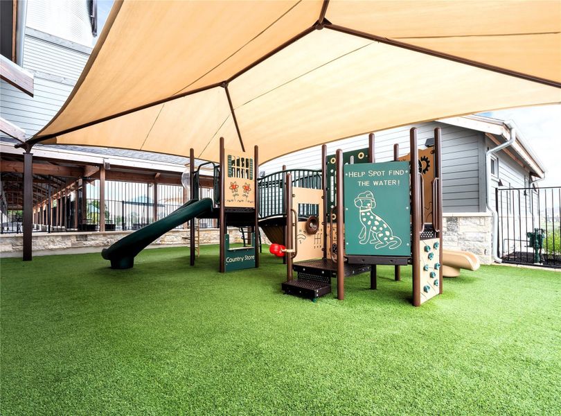 Kids love this well-equipped, shaded playground with artificial turf for year-round enjoyment.