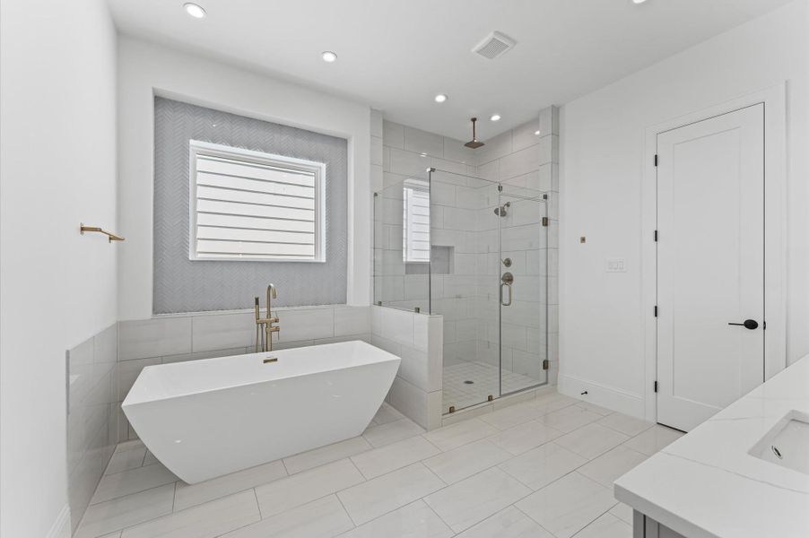 Primary bath. *Previous Brownstone Living project, selections and floor plans may vary.*