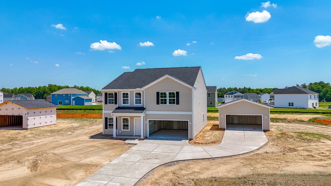 Front exterior of a new home in Cambridge Reserve, Angier, NC, highlighting curb appeal (Image 2). Front exterior of a new home in Cambridge Reserve, Angier, NC, highlighting curb appeal (Image 2).