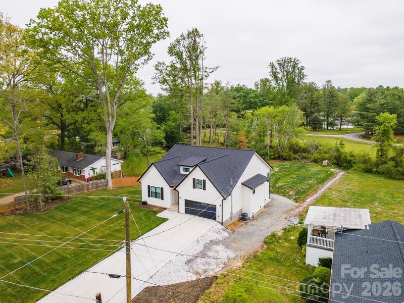 Front exterior of a new home in , Hendersonville, NC, highlighting curb appeal (Image 24).