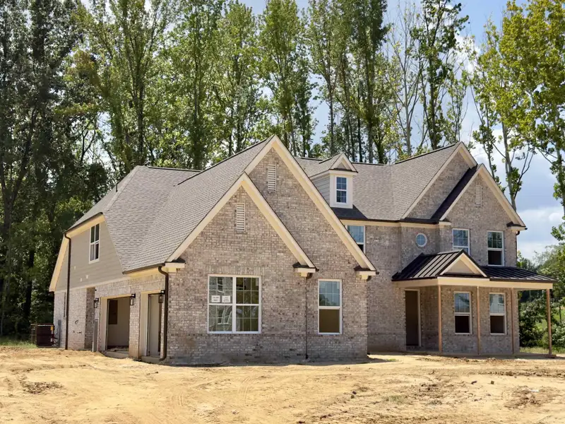 Front exterior of a new home in White Oak, Arlington, TN, highlighting curb appeal (Image 2).