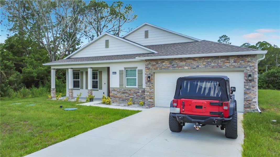 Front exterior of a new home in Palm Bay, Palm Bay, FL, highlighting curb appeal (Image 28).