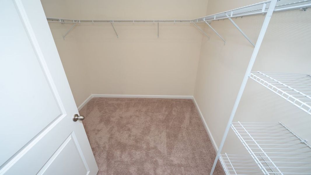 Representative unfurnished interior of a home built from the CALI by D.R. Horton in The Reserve at Wild Horse, Conway (Image 32).