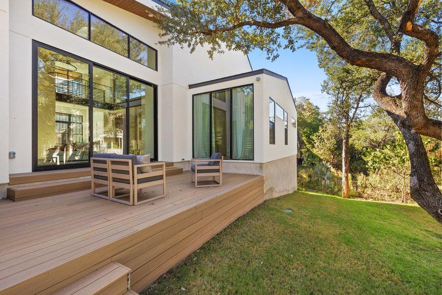 Step outside to a private, high-end deck overlooking a parklike backyard shaded by mature oak trees.