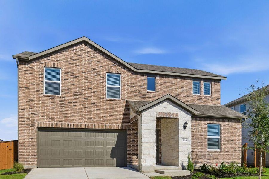 Front exterior of a new home in Emory Crossing 50s, Hutto, TX, highlighting curb appeal (Image 2).