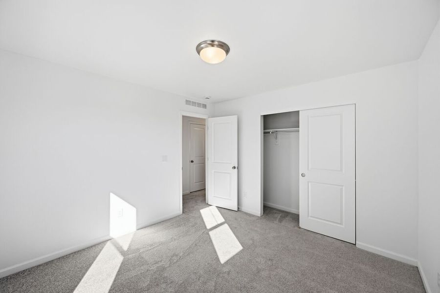 Spacious, unfurnished interior of a new home in Trailstone Town Collection, Arvada (Image 28).