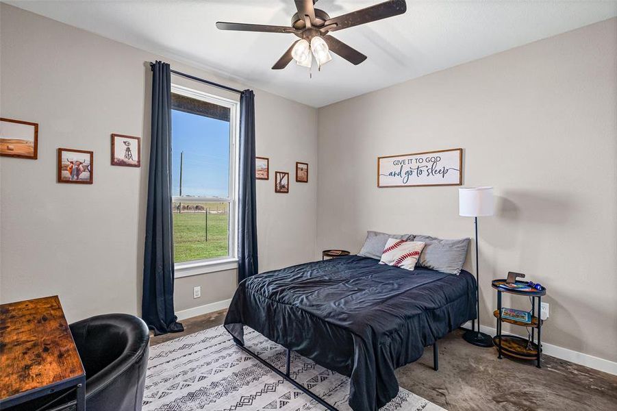Bedroom with baseboards and ceiling fan Bedroom with baseboards and ceiling fan