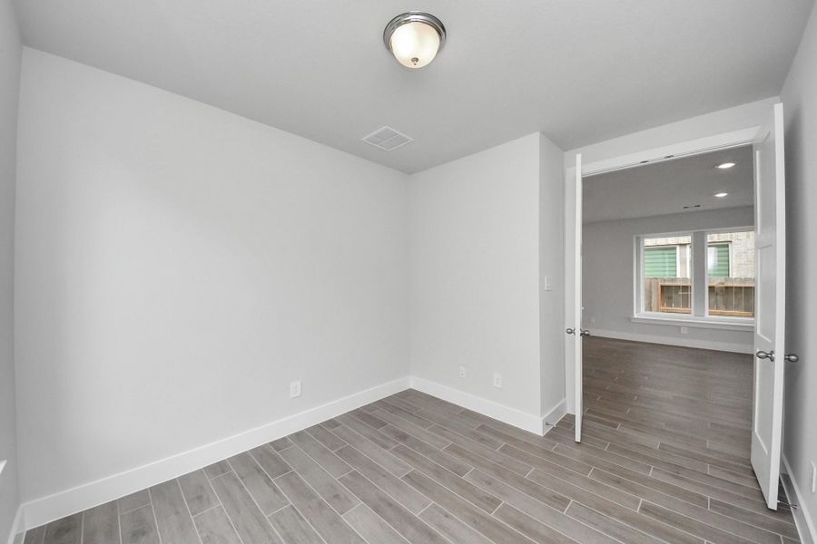 Spacious, unfurnished interior of a new home in Amira: Premier Collection, Tomball (Image 30).