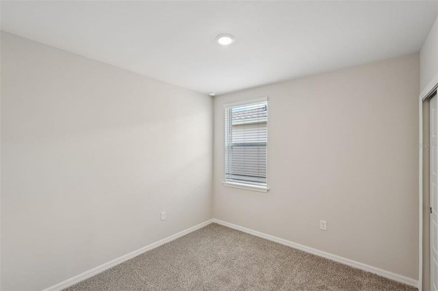 Spacious, unfurnished interior of a new home in Crescent Lakes - Premier Series, Punta Gorda (Image 15).