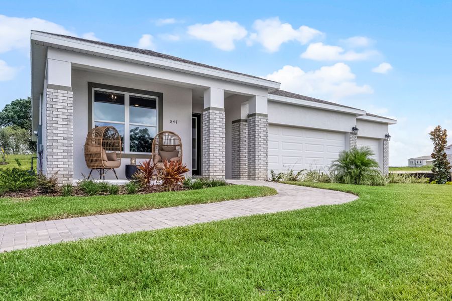 Representative exterior photo of a completed home built from the Everly by Hartizen Homes in Eden Crest Single Family Homes, Apopka, FL (Image 26).